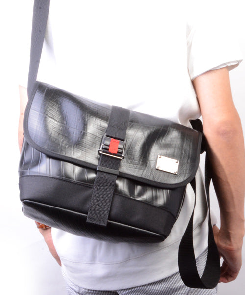 Messenger bag with seat belt online buckle